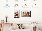 a picture of a living room with a couch and pictures on the wall