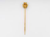 a gold plated stick with a lion head on it