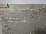 an old trunk with writing on the side of it