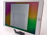 tablet computer with a tablet screen sitting on top of a table