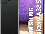 a close up of a person holding a black samsung galaxy s20
