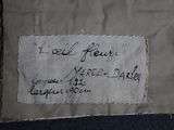 a piece of fabric with writing on it on the floor