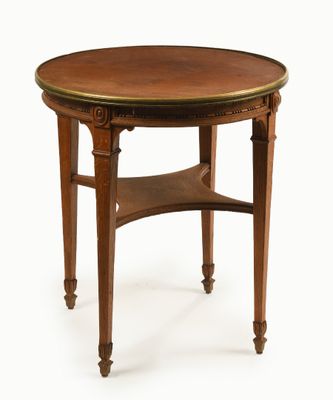 une image représentant une table ronde avec un plateau et des pieds en bois