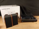three speakers that are sitting on a table next to a box