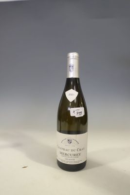 a bottle of wine that is sitting on a table