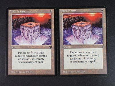 two cards with a picture of a mountain and a cliff on them