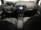 the interior of a small car with a steering wheel and dashboard