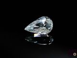 an image of a diamond on a black surface with a black background