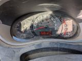 a close up of a car dashboard with a speedometer