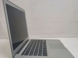 a laptop computer sitting on a table with a white background