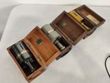 a small wooden box with a bottle of wine inside of it