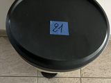 a small black table with a blue sticker on it