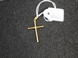 a cross on the ground with a price tag attached to it
