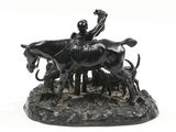 a statue of a man on a horse with a cow