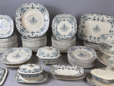 many different types of blue and white plates on the table