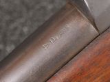 an image of a close up of a rifle with a wooden handle
