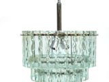 a glass chandelier hanging from the ceiling