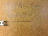 a picture of a piece of wood with writing on it