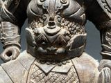 an old statue of a man with a lion on his back