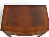 a small wooden table with a drawer underneath it