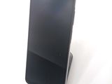 a cell phone that is sitting on top of a stand