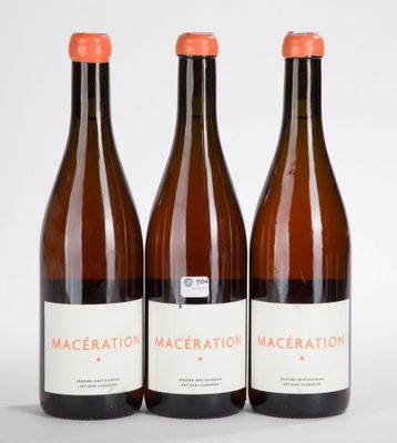three bottles of wine sitting next to each other on a table
