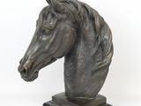statue of a horse ' s head on a marble base