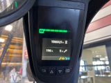 a close up of a parking meter with a clock on it