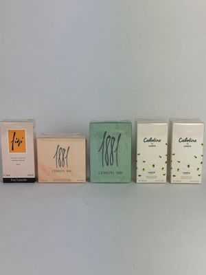four boxes of cigarettes are lined up on a shelf