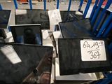 a pile of laptops sitting on top of a cart in a store