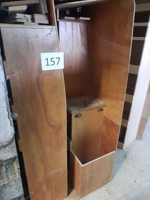 a wooden cabinet with a number on it in a room