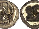 a silver coin with an image of a woman and a man on it