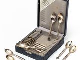 silver spoons and spoon spoons in a case