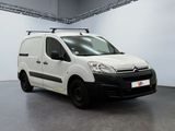 the white van is parked in the garage with a roof rack