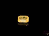 a yellow diamond on a black background
