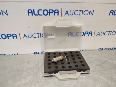 a box with a bottle of alcohol sitting on top of it