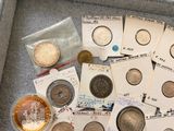 a lot of coins in a case on the floor