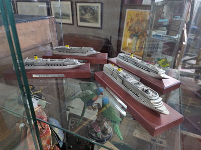 many model ships on display in a glass case