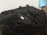 a pile of luggage sitting on the floor next to a wall