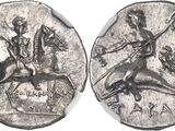 a close up of a coin with a man on a horse