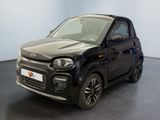 a picture of a small black car parked in a room