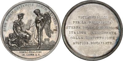 an old silver coin with a picture of a woman and a man on it