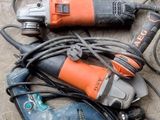 two electric tools laying on the floor next to each other