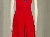 a red dress on a mannequin display on a mannequin stand