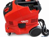 red vacuum cleaner machine on a white background with a cord