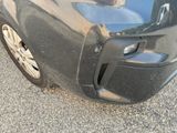 a close up of a car that has a denting on it