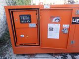 a close up of an orange box with a control panel on it