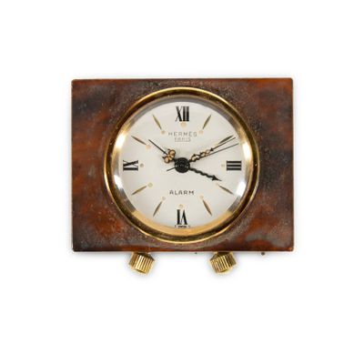 a clock with roman numerals on the face of it