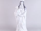 white statue of a woman holding a baby in her arms