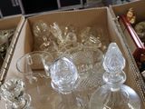 a lot of glassware in a box on the floor